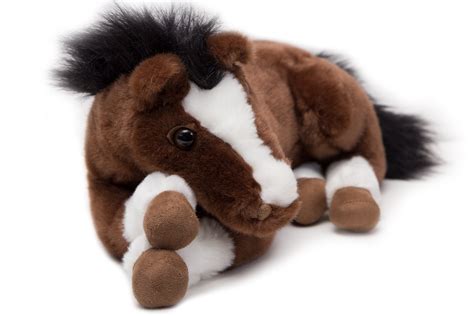 Plush horse - The Schylling Pony Trails Stick Horse is a plush horse on a stick with a harness for easy gripping. It makes a horse galloping sound and has a tail, providing a realistic riding experience for children aged 3 and up. This is a great toy for imaginative play, encouraging children to take on the role of a cowboy or cowgirl and gallop around the ...
